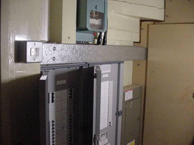 underneath stairs: Houses electric unit not