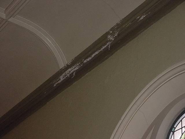 Dated, paint flaking indicating leaking roofs or cold