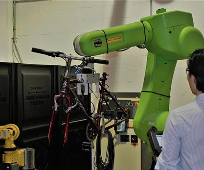 COBOTS ARE MORE INTUITIVE Traditional robots require highly trained robotic programmers to set their movements.