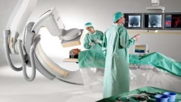 opensurgery to minimally invasive intervention over-the-wire treatment with intelligent devices