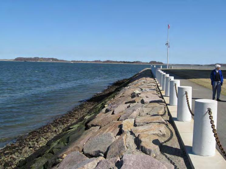 1: View of existing JFK Library shore protection and harborwalk, looking