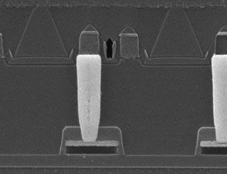 SEM section views of metal 1-to-poly 1