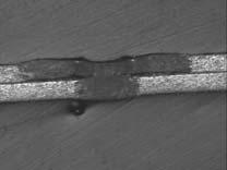 re 12. Fig. 12 (a) shows an example of a sound full-penetration weld with the area of lap joint weld, which was smaller than that of spot-weld fusion zone on the bottom surface.