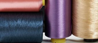 The experimental data have shown, for example, that for both PA and PET solution-dyed yarns the values of the parameters affecting microplastic fibre discharge are lower than for other types of yarn,
