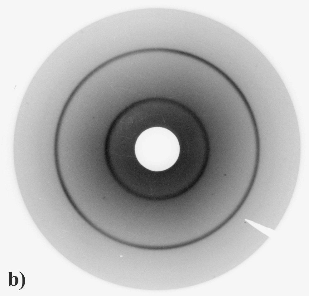 Fig. 10. Debye Scherrer back-reflection diffraction patterns a) rapidly solidified powder and b) extruded material The diffraction circles of extruded material are absolutely homogenous.