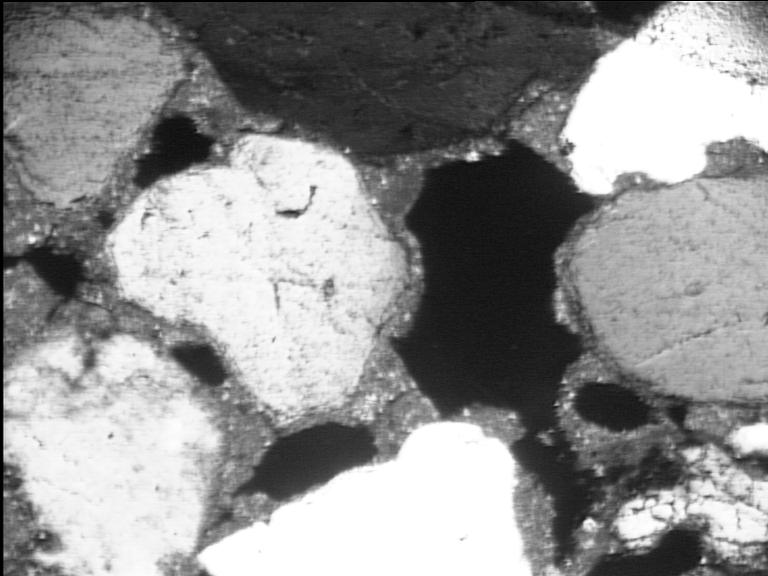 Figure 3. Photomicrograph of a thin section of a new mortar, seen under crossed polars. The area of the photo is 1,0 mm x 1,3 mm. It shows round isometric quartz grains of almost uniform size.