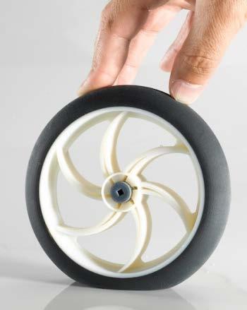 An example of a multi-material application is shown in Figure 20 where the printed outer rubber portion of the wheel is more compliant than the stiffer internal spokes; however, the entire wheel was