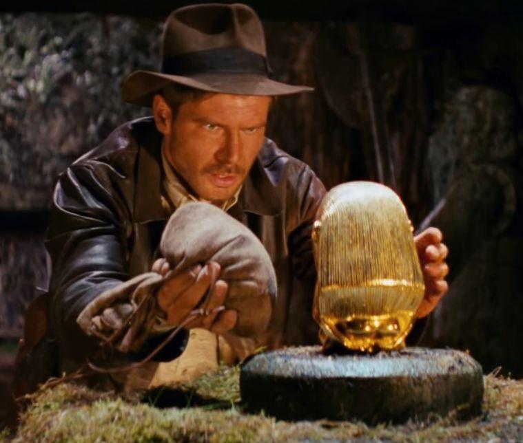 Indiana Jones and the Golden Statue In the famous opening scene of the movie Raiders of the Lost Ark, the character Indiana Jones steals a golden statue by replacing it with a bag of sand.