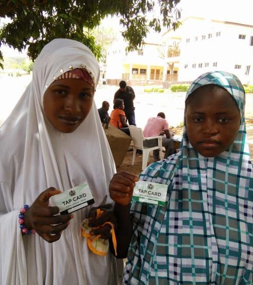 Figure 3: A Sponsored Farmer and Her Sponsor with their TAP Cards, Redemption in Sokoto State The TAP card is used to authenticate the farmer to the TAP service whenever they interact with the