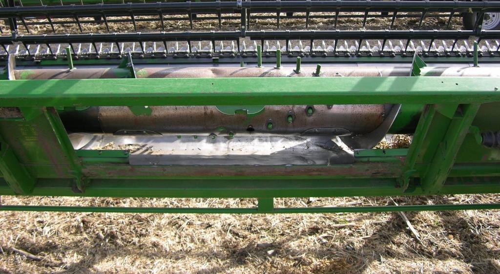 Preparation/Safety Procedures 1. Lower the reel and insert bolts into reel slide arms to prevent reel movement. 2. Remove the head from combine. 3.