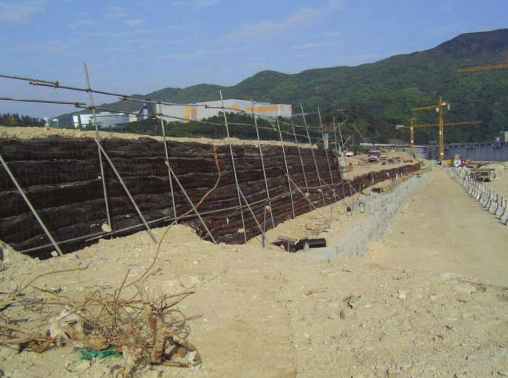 Photo 7. Surcharge embankment under construction (Tseung Table 3. Station. Project details of Tseung Kwan O Subway South Contractor Maeda Corporation Client Mass Transit Railway Corp.
