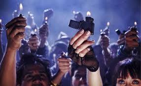 Raised Lighter Tribute Holding up lighters at a concert