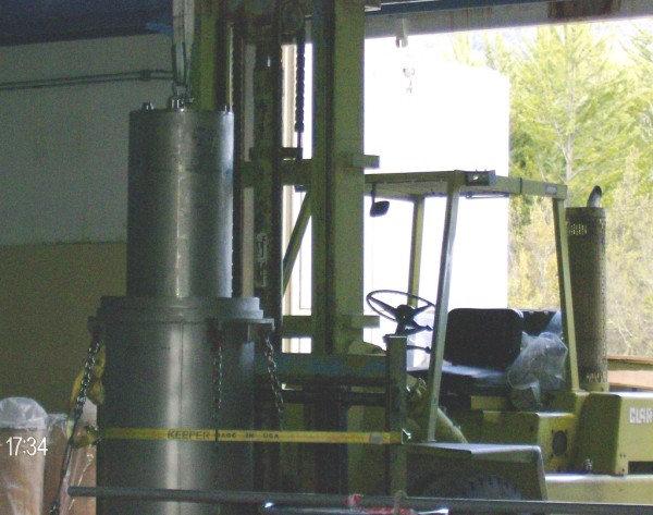 6 TN), that was mounted on a palletised base to facilitate handling with a standard forklift. The loaded IS nested inside the OS to enhance the radiation protection during outdoors operations (Fig.