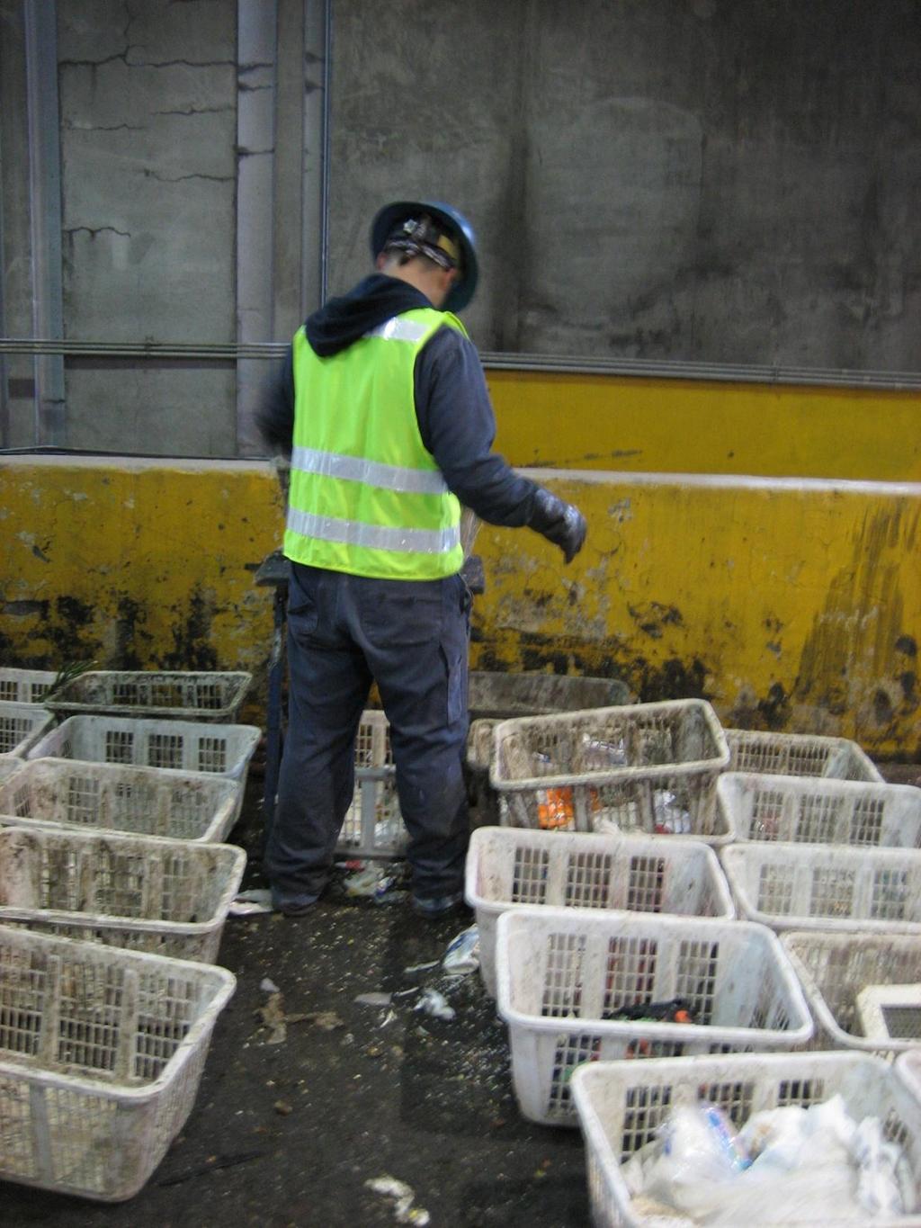 Sorter at work, materials sorted into baskets