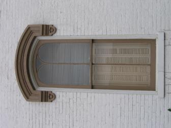Eared (door and window surrounds)- A motif used in Greek Revival door and window surrounds, whereby the lintel projects past the vertical elements, forming ears.