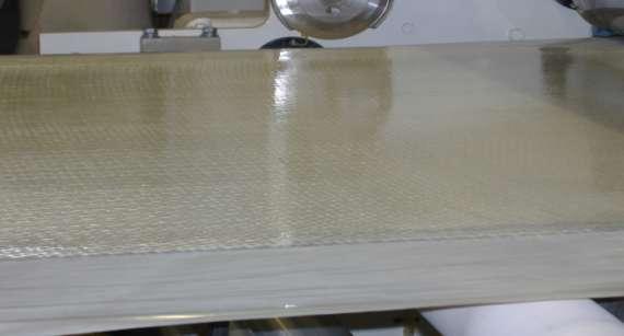 Figure 2: Extrusion Coated Pre-Preg 1800 gsm Glass, 50% FV Polyester Oligomer Initial work with extrusion coating of oligomers was done to produce pre-preg for vacuum bagging.