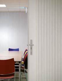 The combination of white Uno walls with the multi-coloured chairs at Tempus in Schiedam provide a