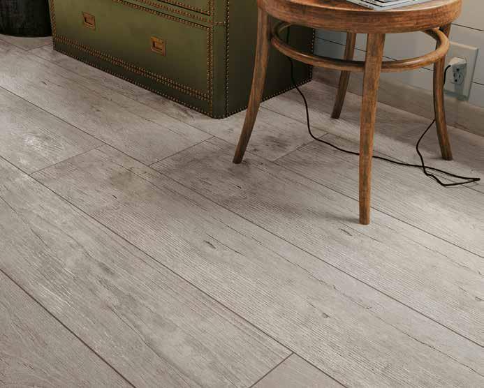 FAMILIAR WARMTH The detailed grain in this authentic wood look collection was directly inspired by reclaimed chestnut planks from a farm s barn door.