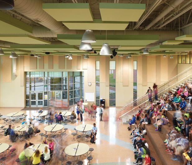 Alfonza W. Davis Middle School, Omaha, Neb. CHALLENGE: Ensure maximum natural daylighting into a threelevel, 185,000-sq-ft, grade 6-8 middle school on an extremely sloped site.