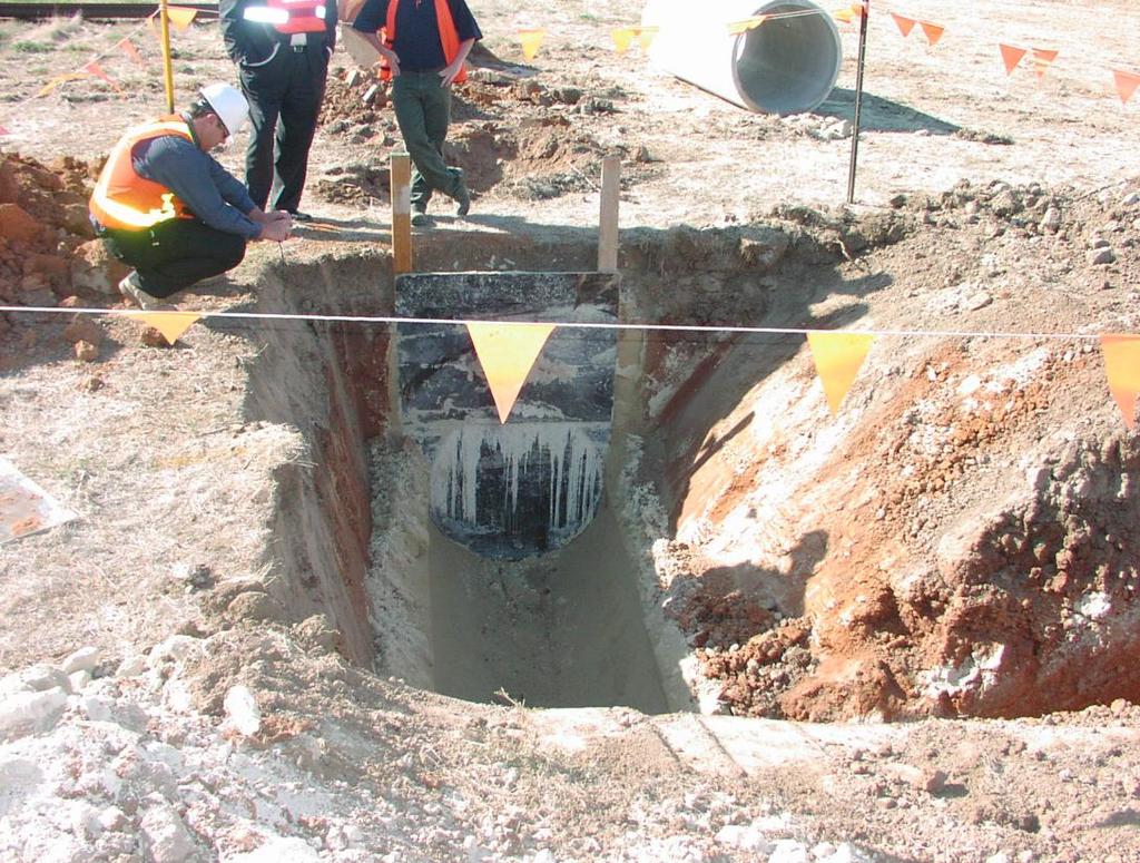 A concrete pipe (background) was placed in the trench and the CLSM poured to mid-height.