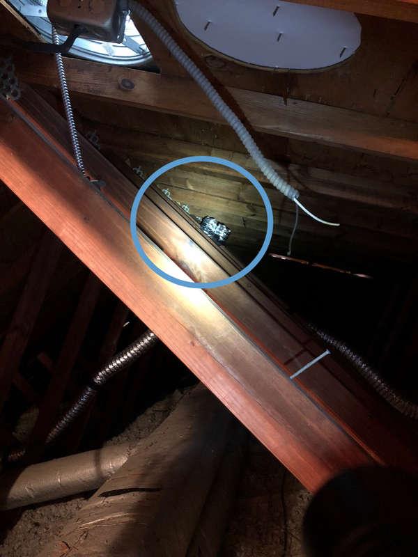 2 Roof Structure & Attic EXPOSED WIRE(S) ATTIC ABOVE BEDROOM Loose wiring below Attic fan was observed at the time of inspection.
