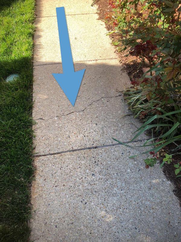 2.1 Driveway(s)/Parking DRIVEWAY CRACKING FRONT Minor cosmetic cracks observed, which may indicate movement in the soil.