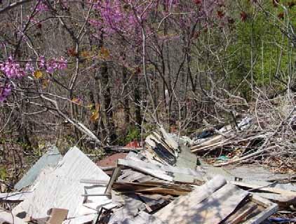 Figure H-1: Illegal dump on south side of Trapp Road Abandoned Landfills North of Barracks Complex - A landfill which contains various unknown materials and substances was created in the early 1970s.