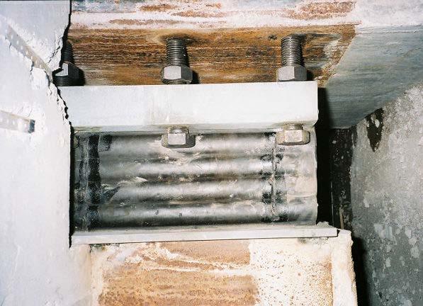 This process was accomplished in 2005 after most of the expected dead load was on the isolated part of the building to minimize the shear load on these side pads.