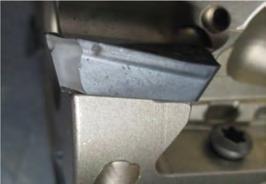 TOOL WEAR OBSERVED ON A HIGH-PERFORMANCE MACHINING CENTER AFTER 38 ROUGHING PASSES IN 4140 ALLOY STEEL. REPLENISH COST WAS $60 FOR FOUR NEW INSERTS.