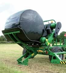 When the rotating table stops and is raised to the tip position, the heavy duty bale damper raises to cradle the bale while a second arm is lowered automatically to the ground.