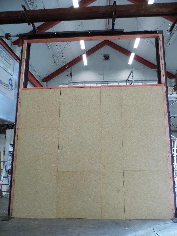 Figure 6. Test Configurations E and F with Particleboard on the Interior (Left) and Rusticated Weatherboard on the Exterior (Right) 3.2.
