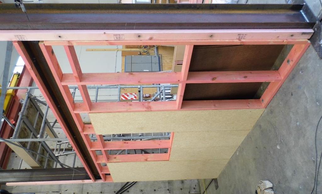 The timber framing was installed from the ground to the bottom of the lower beam and then continued from the top of the lower beam to the bottom of the upper beam and remained in place for Tests B, C