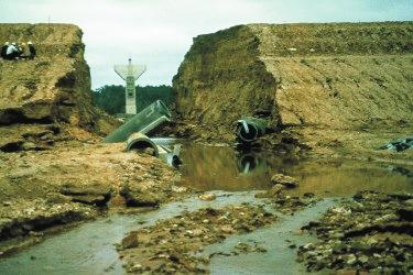 How do conduits affect embankment dams? A conduit represents a discontinuity through an embankment dam and its foundation.