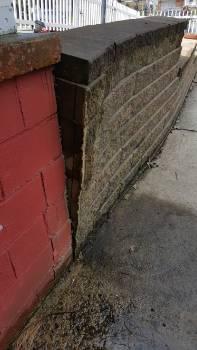 17. Fence Condition Materials: Block Fence leaning in areas. Retaining wall is leaning.