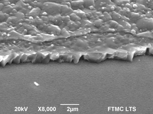SEM image of the P2 scribe in CZTS/Mo/SLG sample: 15 μj laser pulse energy, 12 khz pulse repetition rate, 1000 mm/s scanning speed, +1200 μm focus off-set.