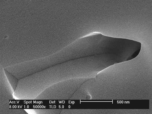 SEM micrographs of fracture surfaces a) pure HA sintered at 12 C and b, c ) 1% whisker reinforced composite sintered at 13 C.