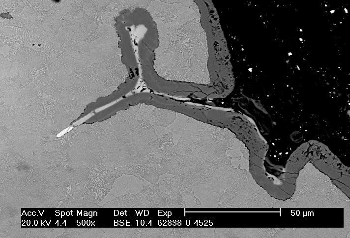 shows an initiation a crack root on separated Zr based inclusions. Dark fringing of the crack is caused by material oxidation. Fig. 8.