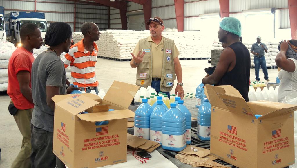 6 Logistics Cluster Improves Preparedness in Haiti Dale Herzog discusses converting large quantities of aid into family-friendly portions at the WFP logistics warehouse A Caribbean nation placed