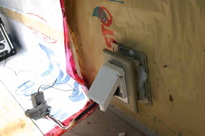 A failed attempt to air-seal an electrical outlet. it was on the cold side of the thermal control layer in a home located in ASHRAE Climate Zone 6.