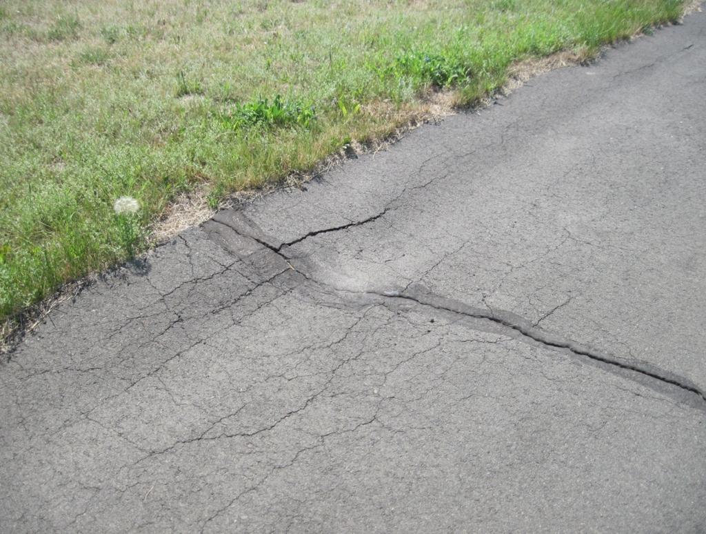 Rutting Rutting is a surface depression in the pavement that is caused by repeated wheel loading in excess of the structural capacity of any or all of the pavement layers.