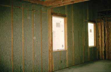 1.1 AIR BARRIER AND THERMAL ALIGNMENT Figure 1.1.9 - Blown cellulose insulation Several options outside of traditional batt insulation are available. Figure 1.1.9 shows wet-spray cellulose insulation.