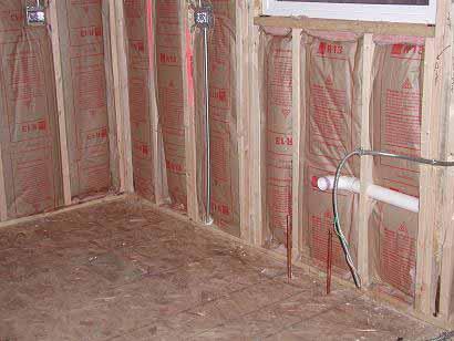 1.1 AIR BARRIER AND THERMAL ALIGNMENT Figure 1.1.5 Misalignment of insulation due to compression Figure 1.1.5 shows a common insulation installation practice called inset stapling where tabs of faced batts are stapled to the inside edges of wall framing.