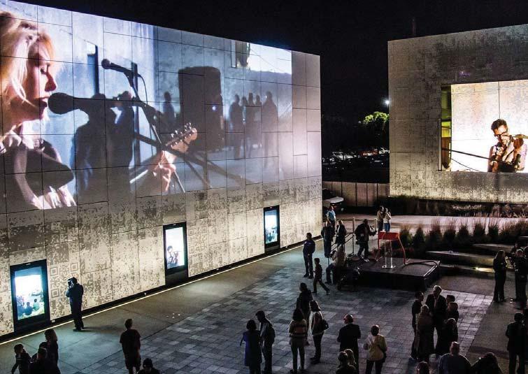 J. Projected Imagery: Projection Mapping on a building facade, also known as video mapping and spatial augmented reality that uses projection or comparable technology to map light and images