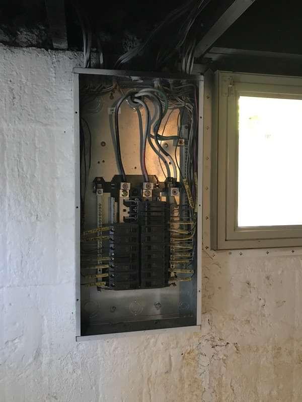 MISSING Safety Hazard "Knockouts" are missing on the electric panel.