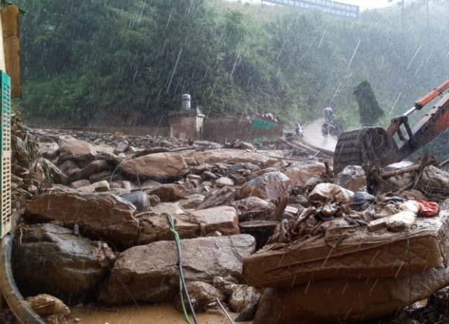 Damage caused by landslide, flash flood