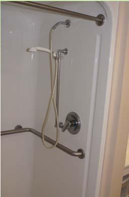 Standard Roll-in Showers: 608.4.2 Controls and Hand Showers Eliminated 38 inch minimum height for controls.