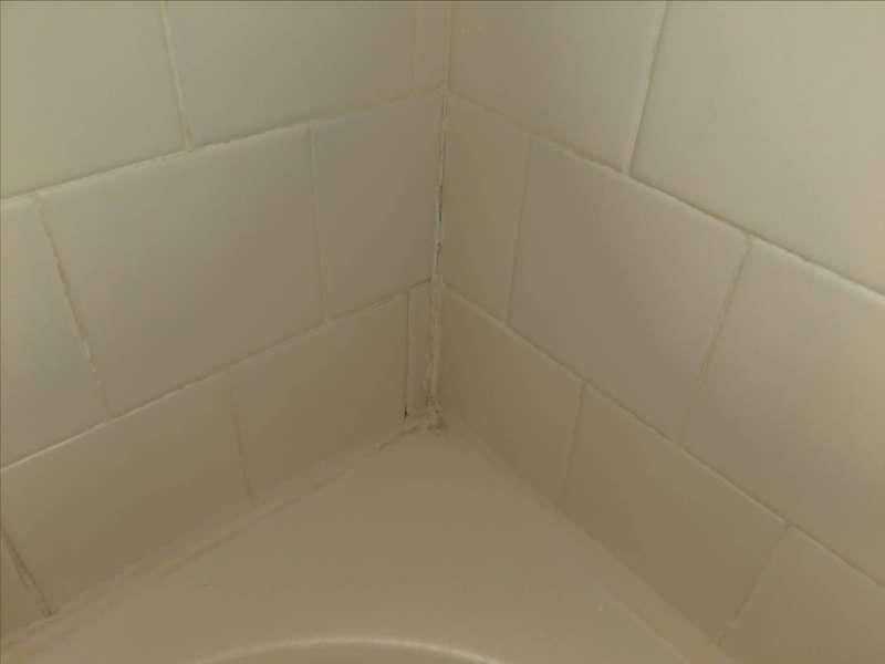 loose tiles near the faucet.