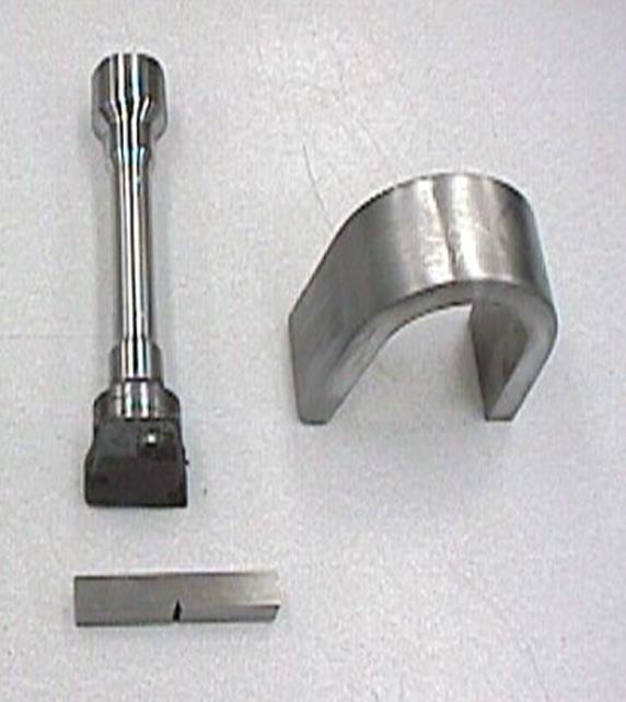 This shows some of the typical steel samples used for mechanical testing. Top left is the tensile specimen that will be pulled and the strength is measured.