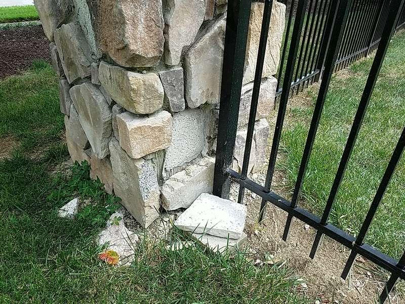 2 Fence LOOSE STONES ON COLUMNS REAR LAWN The stonework is incomplete on