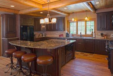 LEFT: Rustic cabinetry, wood ceilings outlined with log beams and metal-and-leather barstools combine to create a rustic backdrop in this spacious and functional kitchen.